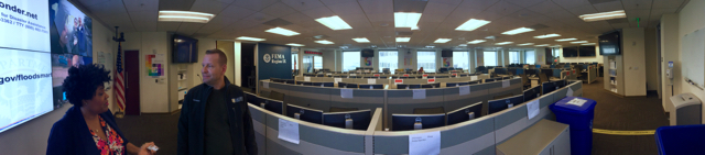 Kelly Hudson and Robb Mayberry stand at the front of FEMA Region IX's Regional Response Coordination Center