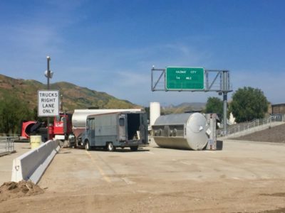 photo of simulated overturned tanker on section of highway at Del Valle